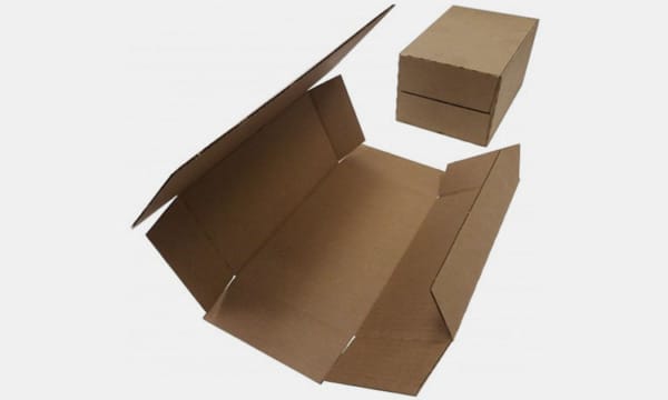 Packaging system Cardboard box packaging system for wraparound automation